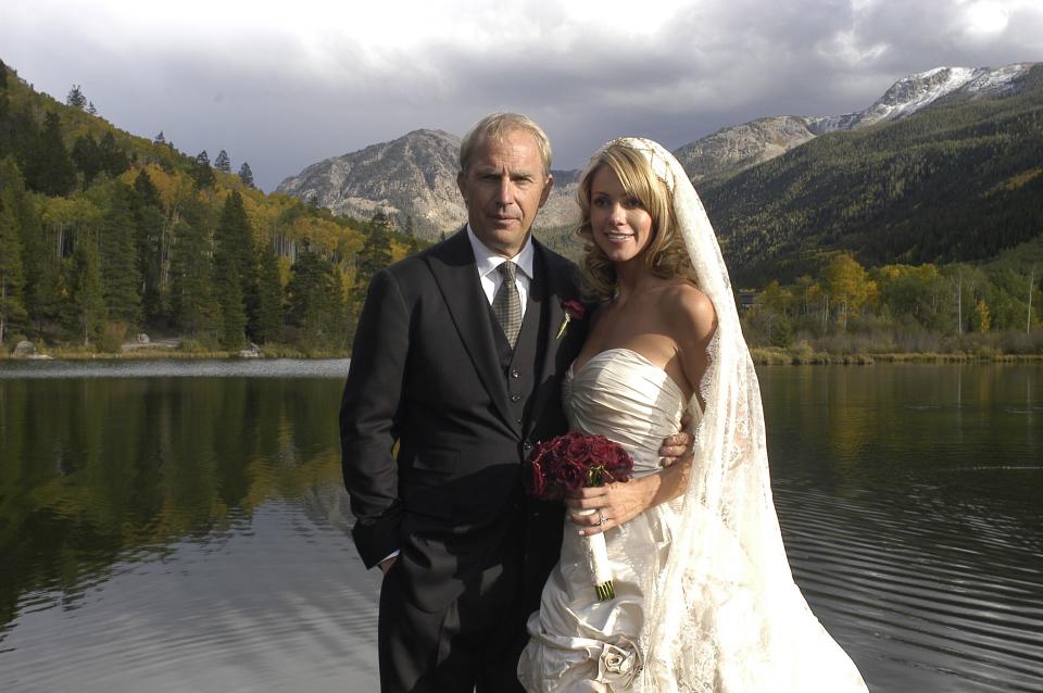 Actor Kevin Costner poses with his new wife Christine Baumgartner during their private wedding at his ranch in September 25, 2004 in Aspen, Colorado.