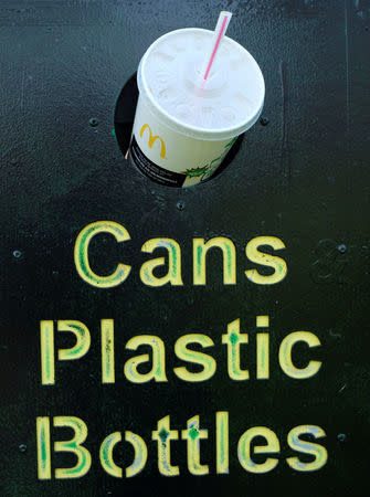 A McDonalds drink with a straw protrudes from a bin in a illustration picture in Loughborough, Britain April 19, 2018. REUTERS/Darren Staples