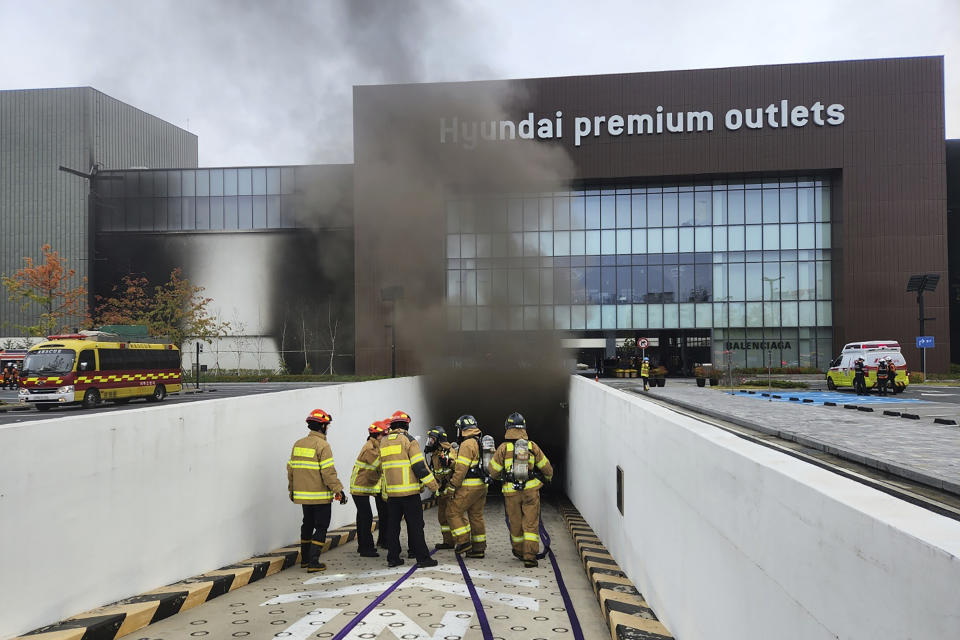 South Korean firefighters work at a shopping mall in Daejeon, South Korea, Monday, Sept. 26, 2022. The fire broke out in the basement of the shopping mall Monday, killing a number of people, officials said. (Kwak Sang-hun/Newsis via AP)