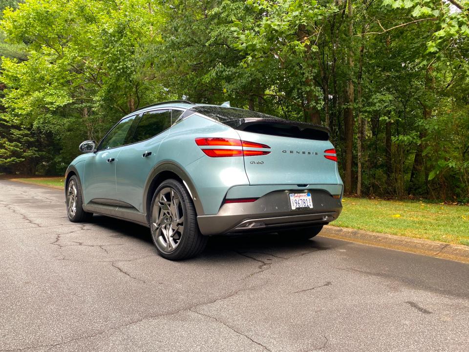 The left rear corner of a green 2024 Genesis GV60 EV.