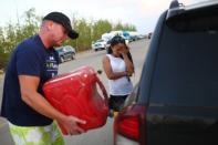 The Alberta government has sent a tanker under guard to help rescue vehicles stranded south of Fort McMurray, with three mobile fuel stations set up along a 200 kilometer stretch of road