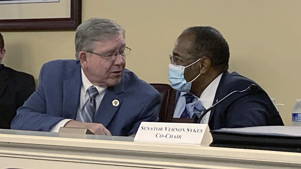 FILE - Ohio House Speaker Bob Cupp, R-Lima, left, and state Sen. Vernon Sykes, D-Akron, discuss details of the Ohio Redistricting Commission's plans for a new legislative district map, Aug. 31, 2021, in Columbus, Ohio. The Ohio Supreme Court has in a 4-3 ruling, Wednesday, May 25, 2022, rejected another round of Republican-drawn Statehouse maps and returned them to the Ohio Redistricting Commission. (AP Photo/Andrew Welsh-Huggins, File)