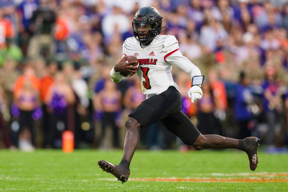 Louisville quarterback Malik Cunningham (3) runs with the ball in the first half of an NCAA college football game against Clemson, Saturday, Nov. 12, 2022, in Clemson, S.C. (AP Photo/Jacob Kupferman)