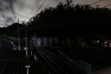 Houses are seen in the dark in a neighbourhood without electricity after the electrical grid was damaged by Hurricane Maria in September, in Dorado, Puerto Rico January 22, 2018. REUTERS/Alvin Baez