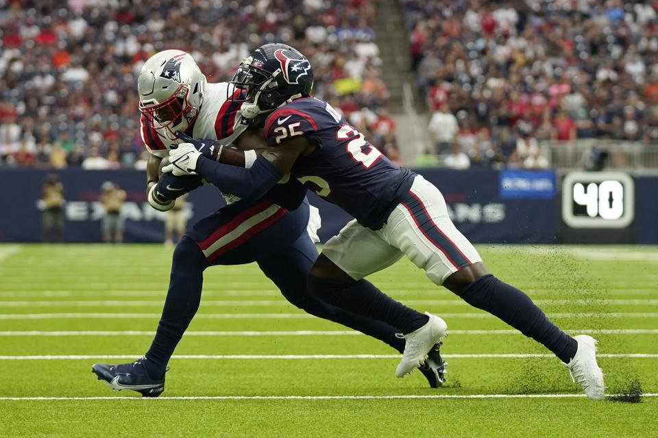 New England Patriots tight end Jonnu Smith (81) is tackled by Houston Texans cornerback Desmond King II (25) during the first half of an NFL football game Sunday, Oct. 10, 2021, in Houston. (AP Photo/Eric Christian Smith)