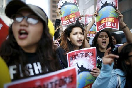 People protest for a $15-an-hour nationwide minimum wage in Los Angeles, California, United States, April 14, 2016. REUTERS/Lucy Nicholson