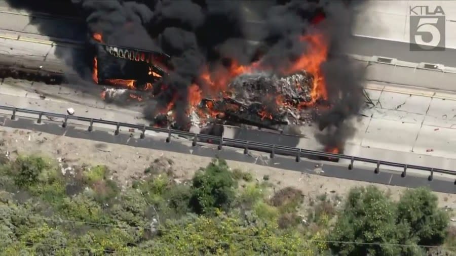 A very large fire tore through a semi-truck on the 5 Freeway on Wednesday afternoon, sending thick plumes of black smoke into the sky and causing heavy traffic delays. (Sky5)