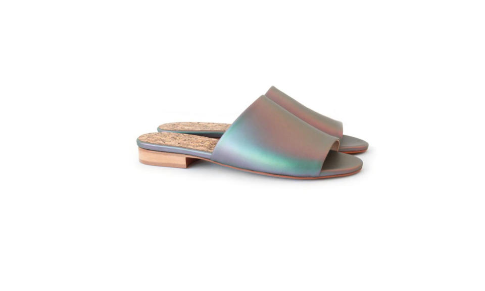 <p>Sydney Brown is the founder of a 100% vegan footwear line. Her emerging brand revolves around the concept of “reverence for life” and focuses on human craftsmanship, animal-free products, and sustainability. <br><br>Flat Slide Matte Iridescent, $245, <a rel="nofollow noopener" href="https://www.sydney-brown.com/collections/shop-woman/products/flat-slide-matte-iridescent?variant=51565078420" target="_blank" data-ylk="slk:sydney-brown.com;elm:context_link;itc:0;sec:content-canvas" class="link ">sydney-brown.com</a> </p>