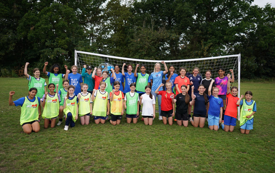Former England goalkeeper Carly Telford with young girls after they took part in FA's Let Girls Play Big Football Day event at the Kings College Fields, Ruislip. Let Girls Play Big Football Day is calling on grassroots clubs from across the country to get involved and celebrate the start of the England Women's World Cup campaign and the growth of women's and girl's football. Picture date: Saturday July 22, 2023. (Photo by Aaron Chown/PA Images via Getty Images)