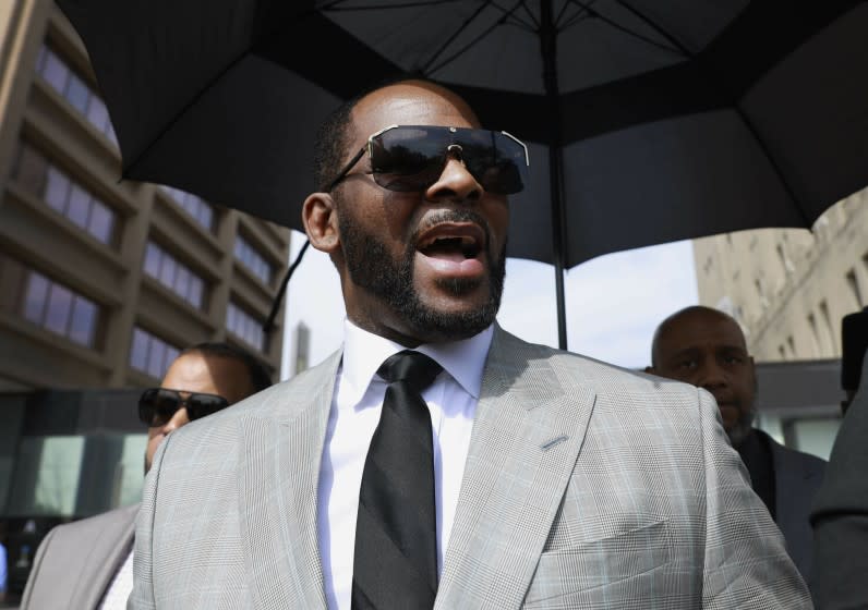 FILE - In this June 6, 2019, file photo, musician R. Kelly leaves the Leighton Criminal Court building in Chicago. Lifetime is readying a follow-up series to "Surviving R. Kelly" called "Surviving R. Kelly Part II: The Reckoning" with one major difference: This time, R Kelly will be behind bars when it airs. (AP Photo/Amr Alfiky, File)