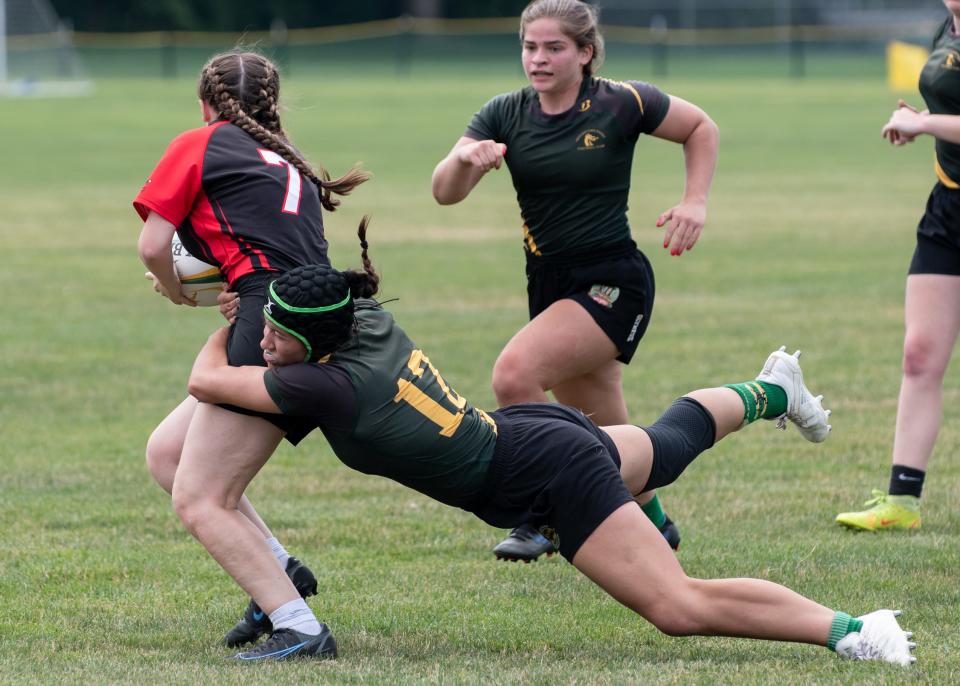 Doylestown Girls Rugby player, Maggie Austin, comes in for a tackle during the first annual Beauty and the Pitch Tournament championship game against Morris Rugby at Turk Park in Doylestown Township on Saturday, July 9, 2022.