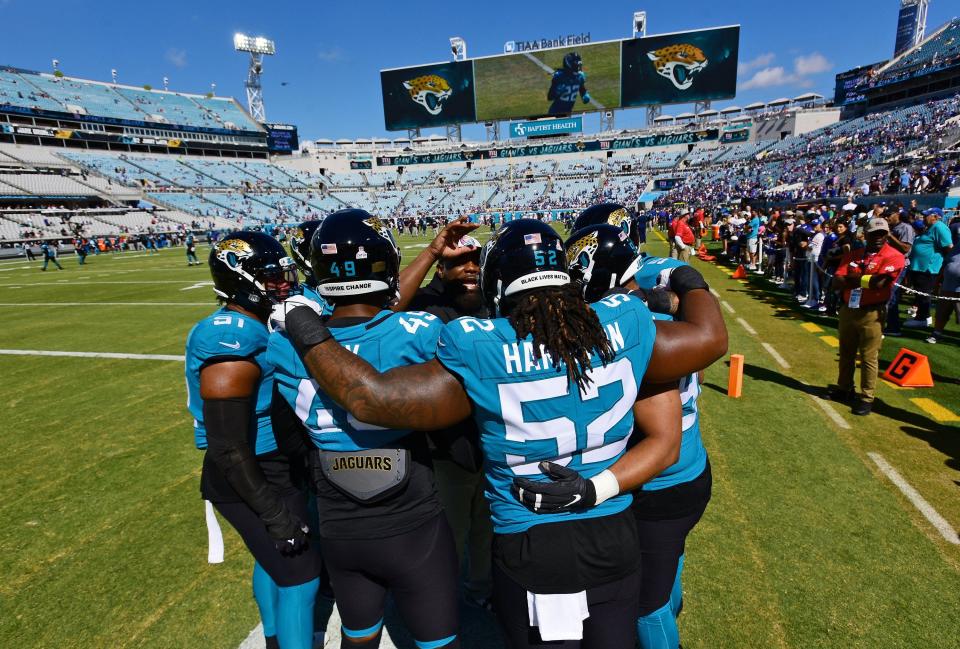 Jaguars defensive players huddle on the field before the start of Sunday's game against the New York Jets. The Jacksonville Jaguars hosted the New York Giants at TIAA Bank Field in Jacksonville, FL Sunday, October 23, 2022. The Jaguars trailed at the half 11 to 13. [Bob Self/Florida Times-Union]