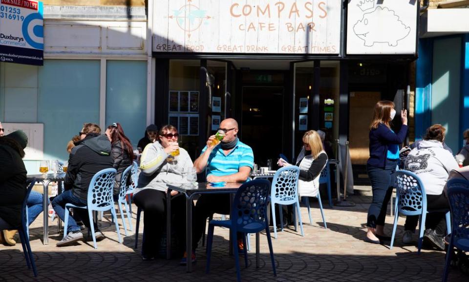 People enjoy drinks outside