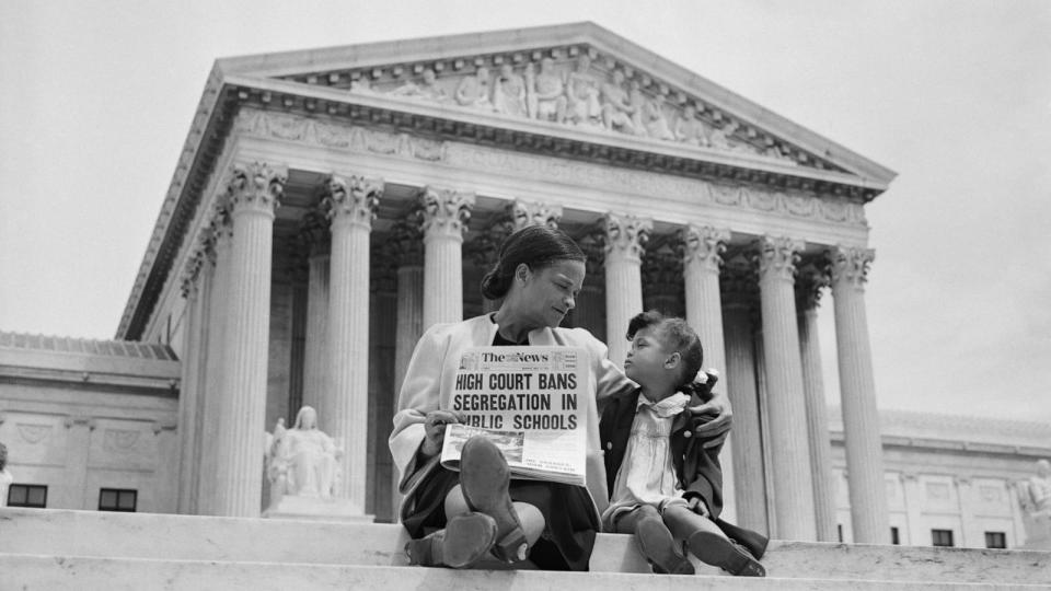 PHOTO: Nettie Hunt and her daughter Nickie sit on the steps of the Supreme Court. Nettie explains to her daughter the meaning of the high court's ruling in the Brown Vs. Board of Education, 1954.  (UPI/Bettmann via Getty Images)