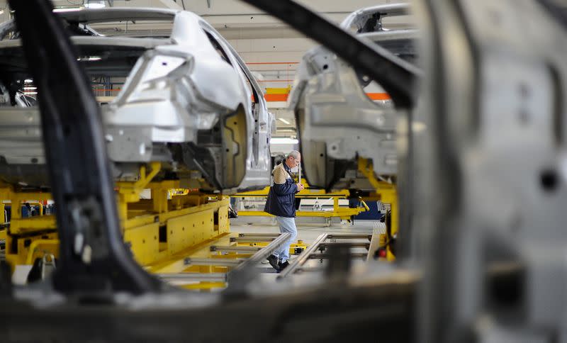 A Maserati assembly staff member works at the Maserati car plant in Grugliasco, near Turin