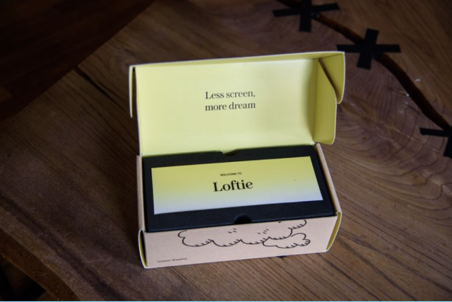 loftie smart alarm clock review in yellow box on wood
