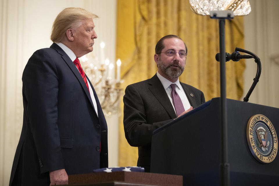 President Donald Trump listens to Department of Health and Human Services Secretary Alex Azar, speaks about coronavirus during an Black History Month reception in the East Room of the White House, Thursday, Feb. 27, 2020, in Washington. (AP Photo/Manuel Balce Ceneta)