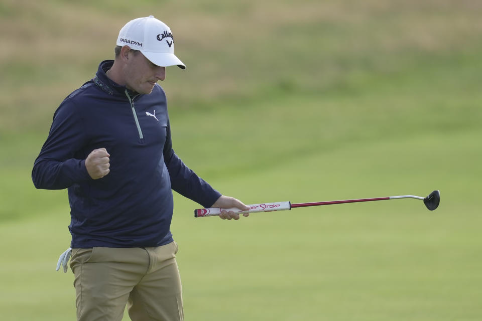 Argentina's Emiliano Grillo reacts after putting on the 18th green on the first day of the British Open Golf Championships at the Royal Liverpool Golf Club in Hoylake, England, Thursday, July 20, 2023. (AP Photo/Kin Cheung)