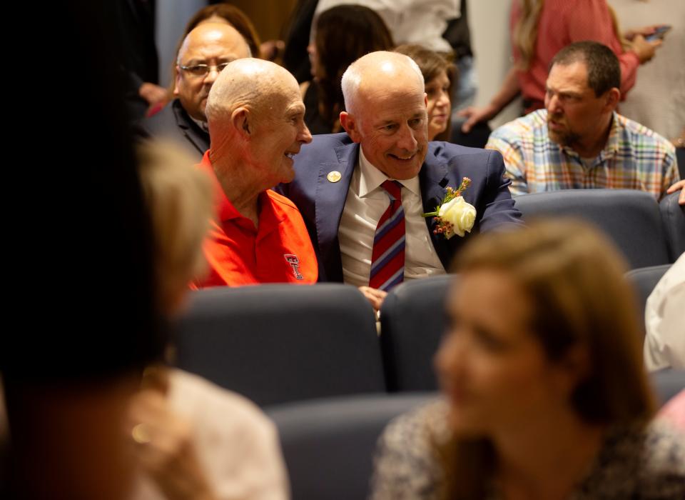 Bill Dean, left, speaks to former Lubbock mayor Dan Pope at the oath of office, Tuesday, May 17, 2022, at Citizens Tower. 