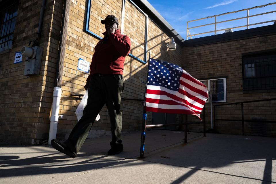 Cassell Dodge, 61, leaves Mount Olivet Baptist Church after voting on Tuesday in Columbus.