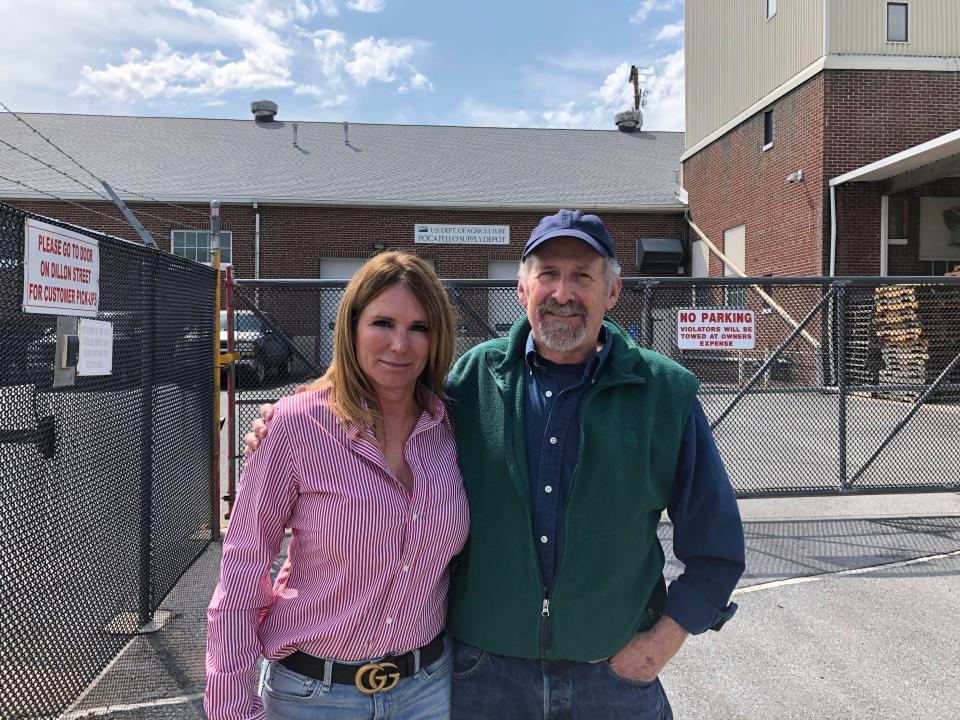 This September 2019 image provided by Predator Defense shows Theresa Mansfield, left, and Brooks Fahy, executive director of Predator Defense, outside a U.S. Department of Agriculture supply depot in Pocatello, Idaho. Mansfield's son was seriously injured when a cyanide device used to kill coyotes and other predators emitted a cloud of poison while he was hiking with his dog in 2017. The Bureau of Land Management made public its decision to end the use of the devices on public lands on Nov. 22.