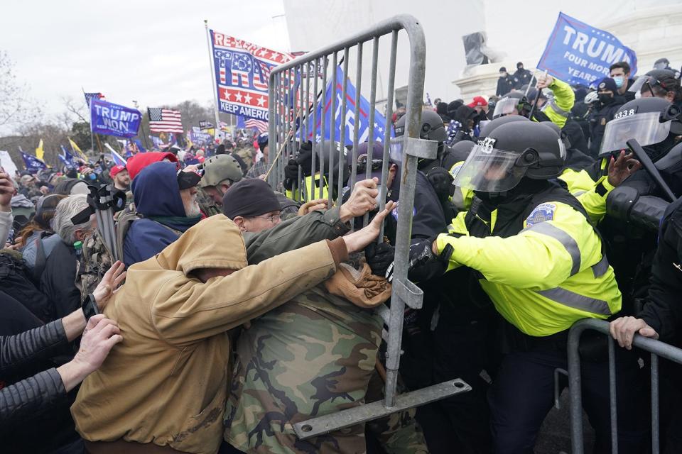 Supporters of President Donald Trump try to force their way through a police barricade in front of the U.S. Capitol on Jan. 6, 2021, hoping to stop Congress from finalizing Joe Biden's victory in the 2020 presidential election.