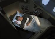 <p><span>Fly First Class with Qantas and your fully flat, extra-wide bed will feature a super sumptuous sheepskin mattress, as well plenty of pillows and cosy blankets. Just what you need after making the most of the fine wine, recommended by one of the Sommeliers in the Sky. [Photo: Qantas] </span> </p>