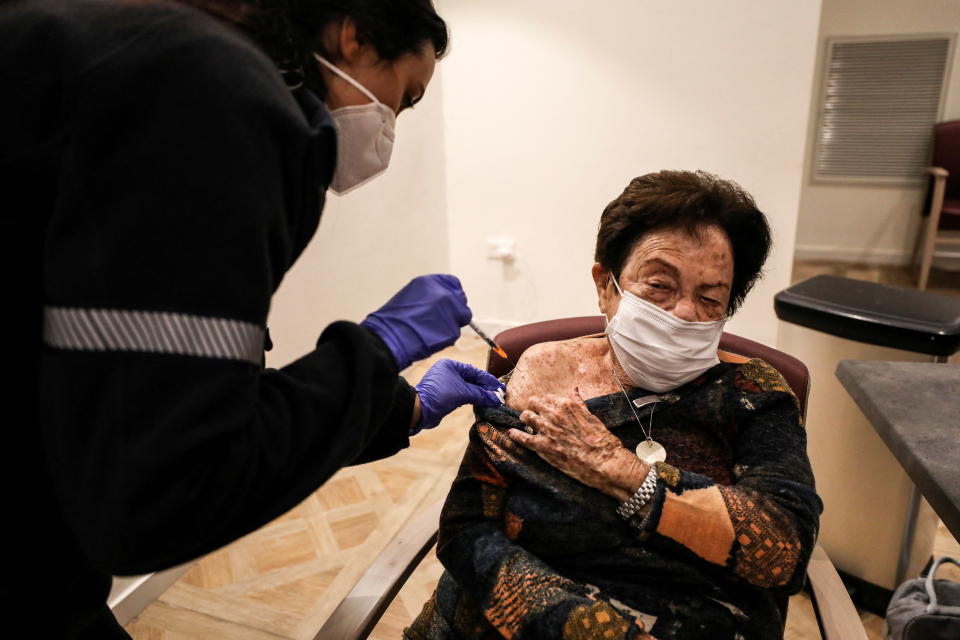 Yodit Ben Ari, 89, receives a fourth dose of COVID vaccine in Netanya, Israel.