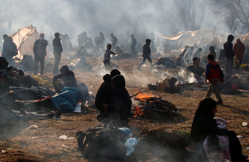 Migrants camp near Turkey's Pazarkule border crossing with Greece's Kastanies, in Edirne