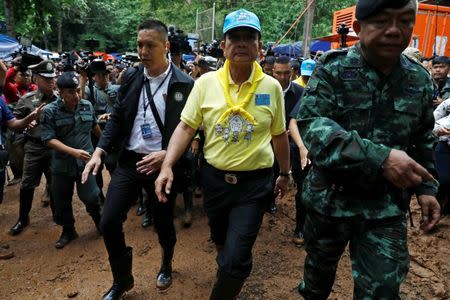 Thailand's Prime Minister Prayut Chan-o-cha arrives at the Tham Luang cave complex during an ongoing search for members of an under-16 soccer team and their coach, in the northern province of Chiang Rai, Thailand, June 29, 2018. REUTERS/Soe Zeya Tun