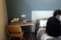 Books and a Rubik's cube are placed in the bedside table of Nathan, a 22-year-old student, in the Rouvray psychiatric hospital, in Rouen, western France, Wednesday, Nov. 25, 2020. Lockdowns that France has used to fight the coronavirus have come at considerable cost to mental health. Surveying points to a surge of depression most acute among people without work, in financial hardship and young adults. (AP Photo/Thibault Camus)