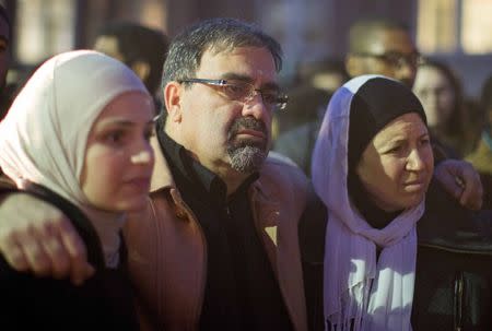 Namee Barakat with his wife Layla (R) and daughter Suzanne, family of shooting victim Deah Shaddy Barakat, attend a vigil on the campus of the University of North Carolina in Chapel Hill, North Carolina February 11, 2015. REUTERS/Chris Keane