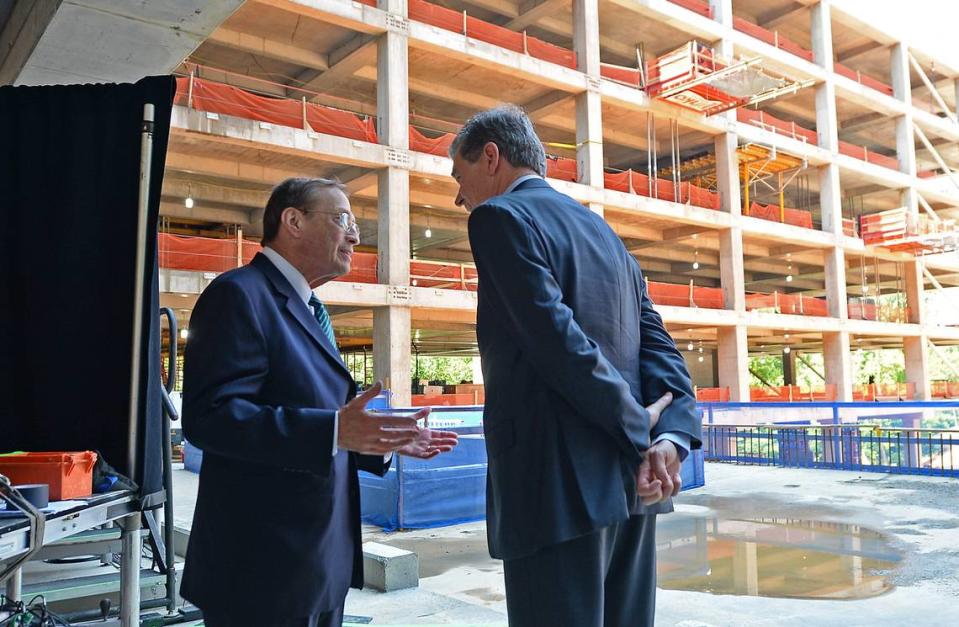 Centene Chairman, President and CEO Michael Neidorff, left, speaks with North Carolina Gov. Roy Cooper following a dedication ceremony June 21 of Centene’s new East Coast headquarters in Charlotte.