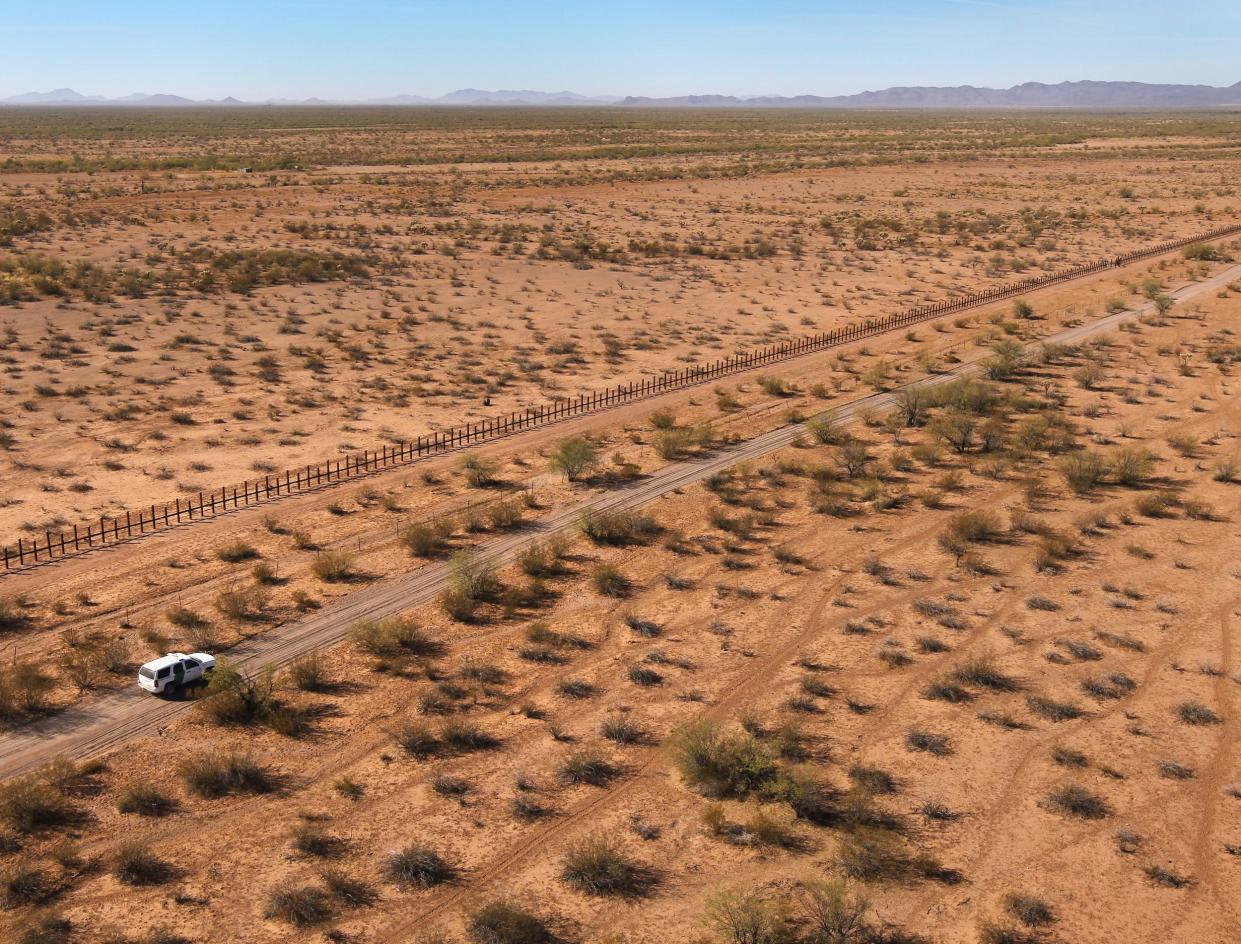 Border Patrol agents drive along the US-Mexico border fence in the Tohono O'odham Reservation, Arizona: Getty Images
