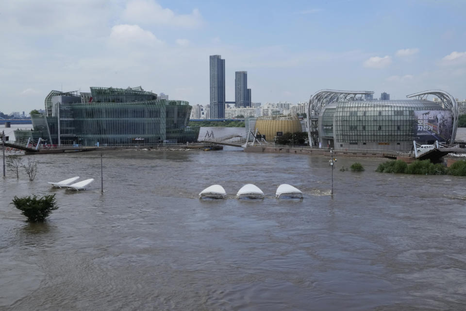 A part of a park along the Han River are flooded due to heavy rain in Seoul, South Korea, Wednesday, Aug. 10, 2022. Cleanup and recovery efforts gained pace in South Korea's greater capital region Wednesday as skies cleared after two days of record-breaking rainfall that unleashed flash floods, damaged thousands of buildings and roads and killed multiple people. (AP Photo/Ahn Young-joon)