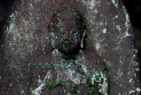 A stone statue at a memorial for Minamata disease victims is seen in Minamata, Kumamoto Prefecture, Japan, September 12, 2017. REUTERS/Kim Kyung-Hoon