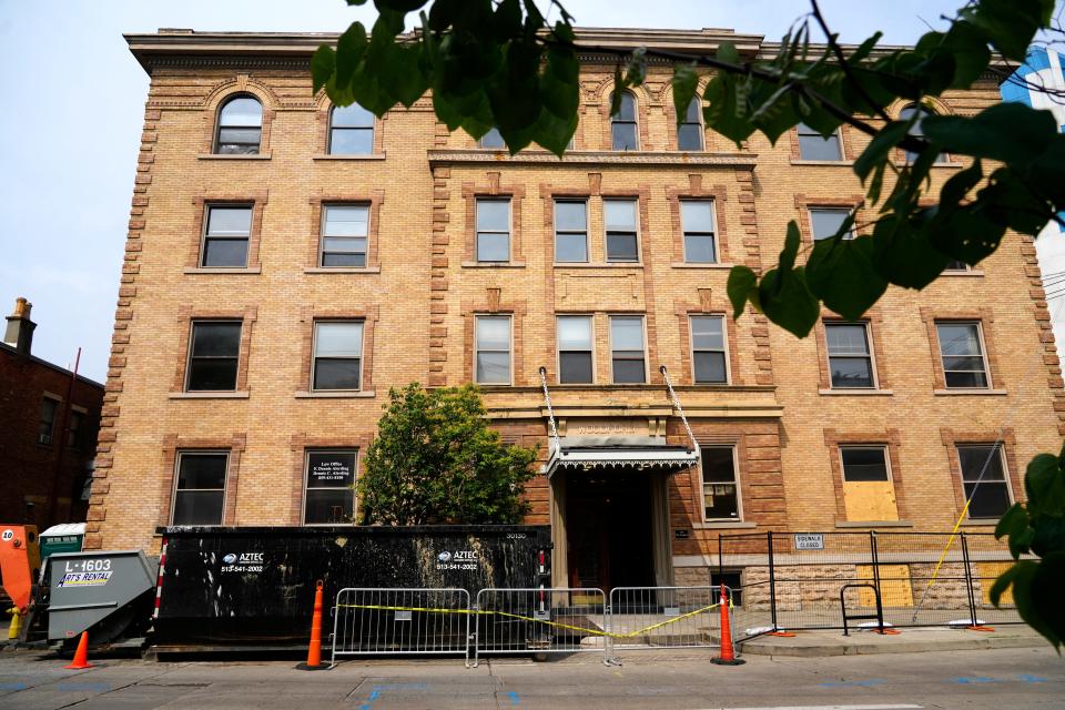 Almost two dozen people were displaced this spring from The Woodford apartments, which is now under renovation in Covington, Kentucky. The building is on Greenup Street, at the foot of the John A. Roebling Suspension bridge.