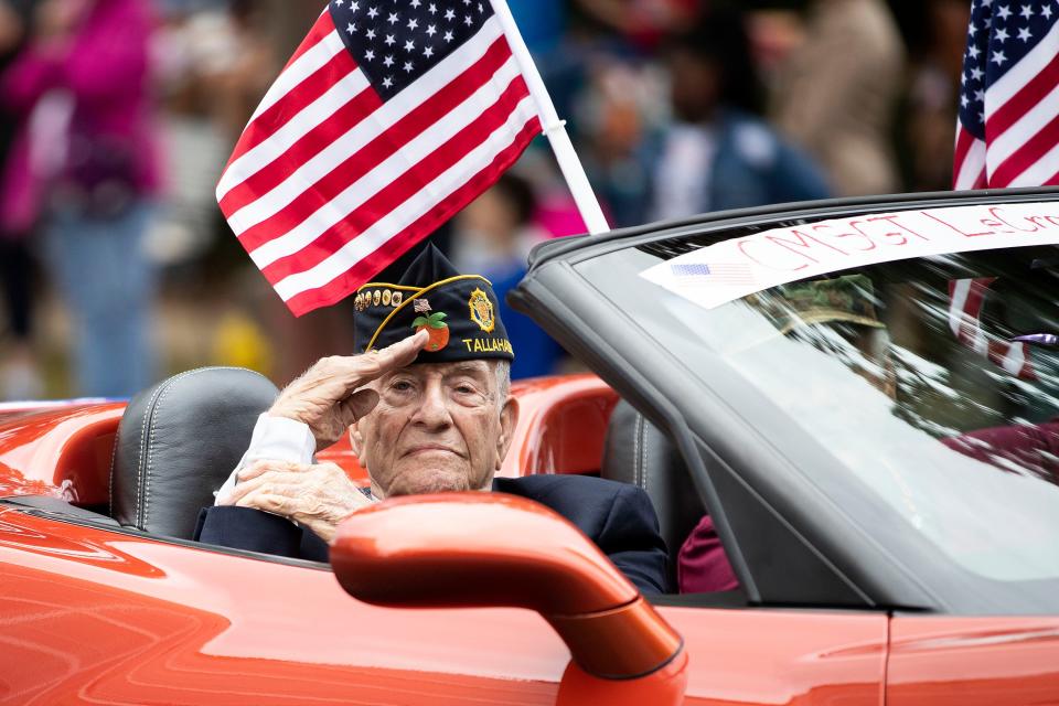 A veteran salutes to parade-goers during the Veterans Day parade on South Monroe Street Friday, Nov. 11, 2022 in Tallahassee, Fla. 