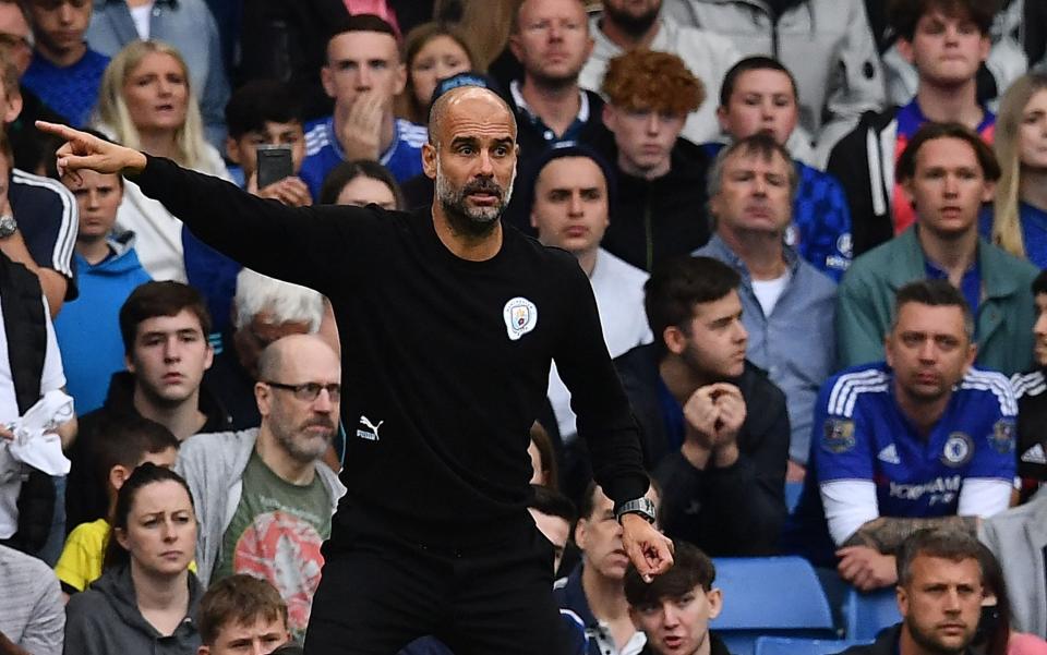 Manchester City's Spanish manager Pep Guardiola gestues during the English Premier League football match between Chelsea and Manchester City at Stamford Bridge in London on September 25, 2021.  - AFP