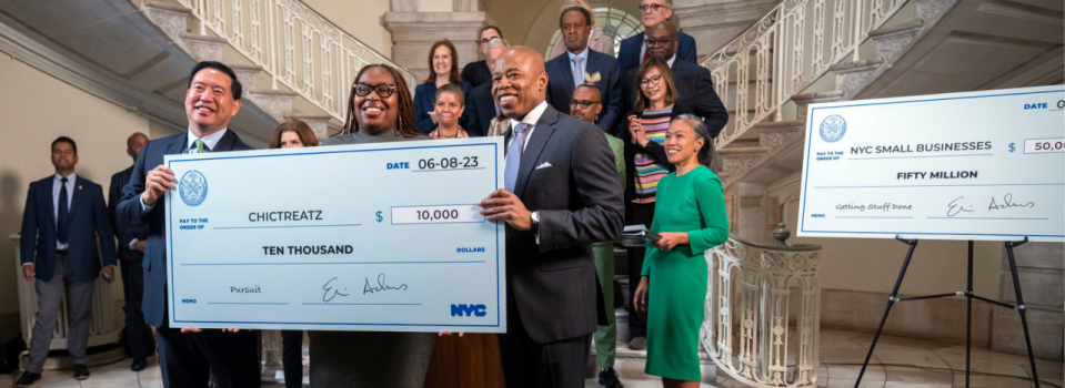 Kevin Kim, left, and New York City Mayor Eric Adams, right, at a June event in which they announced that more than 600 small businesses had received funding from the Opportunity Fund since its inception in January. (Photo courtesy of New York City Department of Small Business Services)