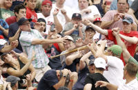 BOSTON, MA - JULY 7: Fans react as the bat of Kelly Shoppach #10 of the Boston Red Sox goes flying into the stands during the third inning of game one of a doubleheader against the New York Yankees at Fenway Park on July 7, 2012 in Boston, Massachusetts. (Photo by Winslow Townson/Getty Images)