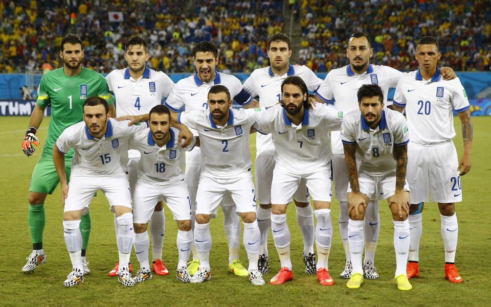 Greece's national soccer team players pose for a team photograph before the start of the during their 2014 World Cup Group C soccer match against Japan at the Dunas arena in Natal June 19, 2014. REUTERS/Kai Pfaffenbach