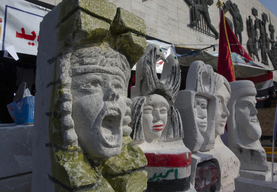 In this Tuesday, Dec. 17, 2019, photo, completed sculptures wait to be stored in preparation for an upcoming art exhibition, during the ongoing protests in Tahrir square, Baghdad, Iraq. Tahrir Square has emerged as a focus of the protests, with protesters camped out in dozens of tents. Dozens of people took part in the simple opening of the sculpture exhibition. (AP Photo/Nasser Nasser)