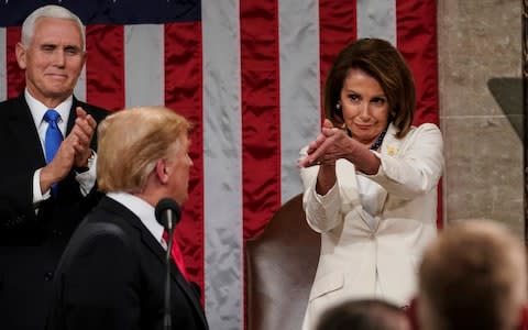 President Donald Trump turns to House speaker Nancy Pelosi of Calif., as he delivers his State of the Union address  - Credit: AP