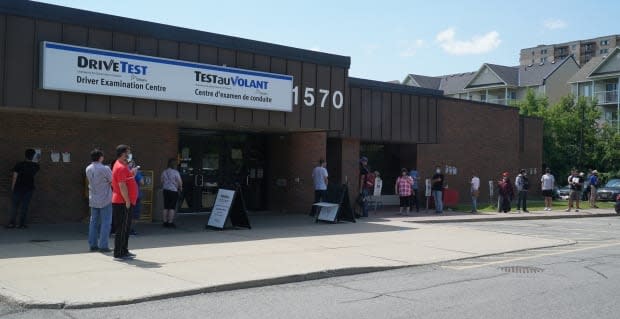 A long line can be seen outside the DriveTest examination centre on Walkley Road in Ottawa last week. (Matthew Kupfer/CBC - image credit)