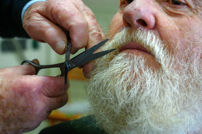 The 90-year-old has been trimming moustaches since 1947 (Ed JONES)