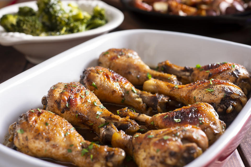 Chicken drumsticks in a baking dish.