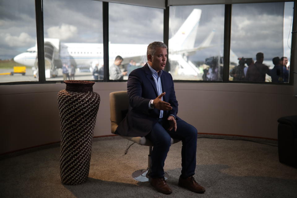 Colombia's President Ivan Duque speaks during an interview with The Associated Press before his departure to attend the U.N. General Assembly from the CATAM air base in Bogota, Colombia, Saturday, Sept. 21, 2019. Duque has ratcheted up pressure against Venezuela's President Nicolas Maduro in recent weeks, accusing him of offering refuge to dissident FARC rebels that decided to break a peace process and take up arms again. (AP Photo/Ivan Valencia)