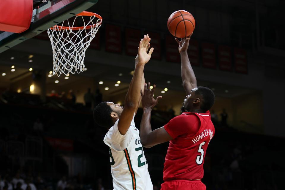 Louisville's Brandon Huntley-Hatfield shoots over Miami's AJ Casey during the first half.