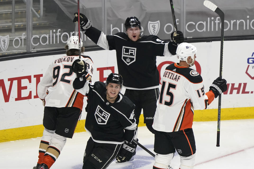 Los Angeles Kings right wing Carl Grundstrom, top center, celebrates after scoring against the Anaheim Ducks during the first period of an NHL hockey game Tuesday, April 20, 2021, in Los Angeles. (AP Photo/Marcio Jose Sanchez)